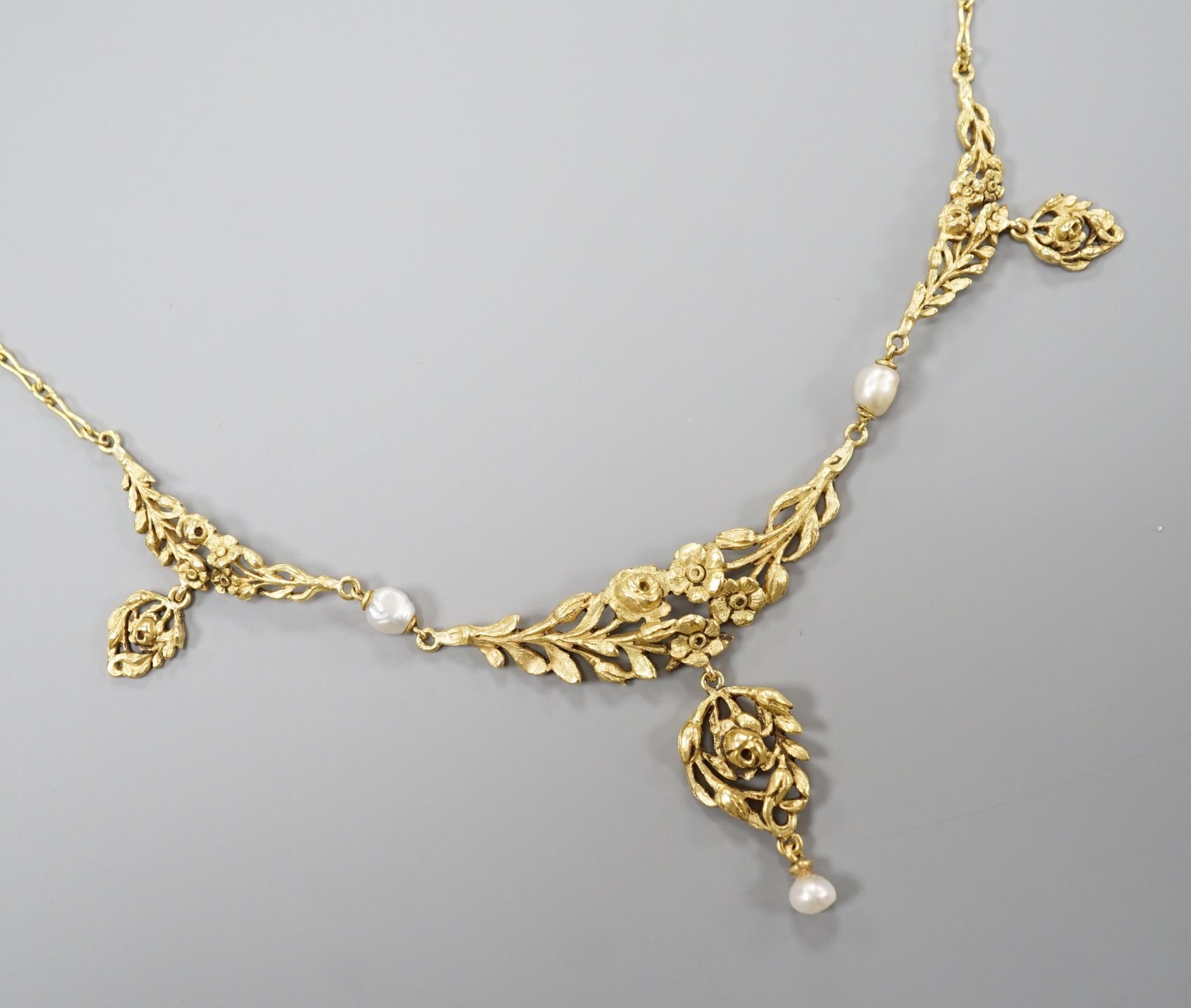 An early 20thcentury French yellow metal (18ct poincon mark) and baroque pearl set drop pendant necklace, 40cm, gross weight 8.1 grams